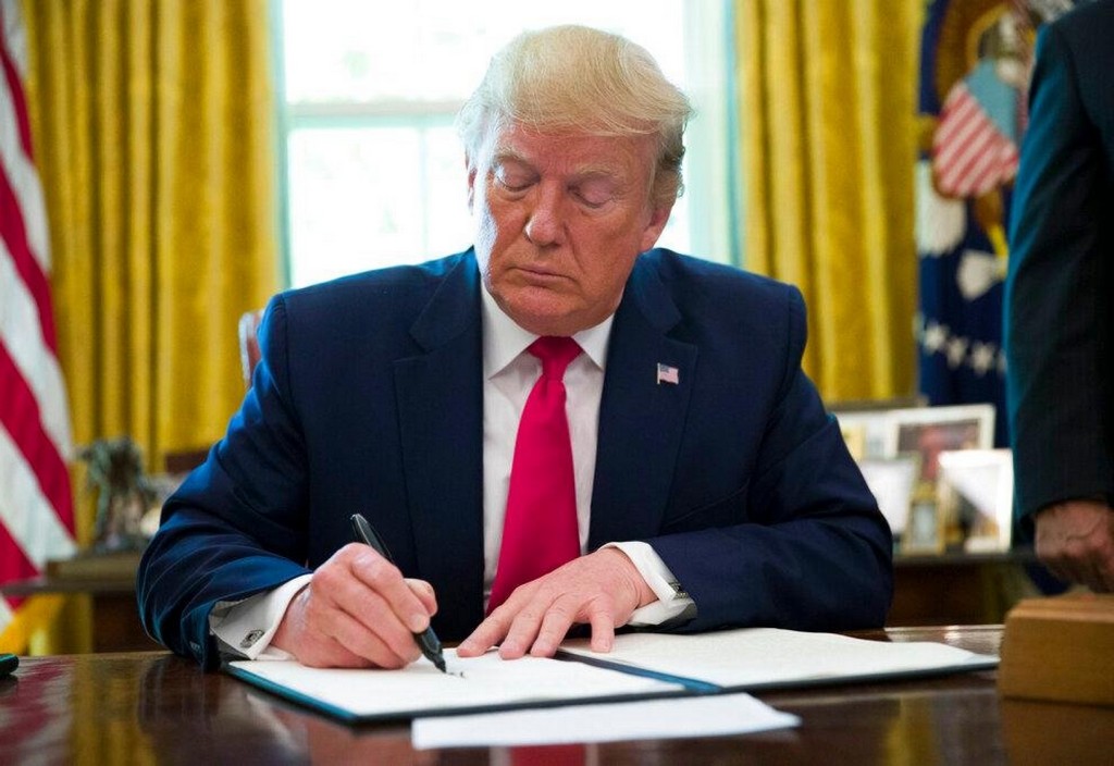 Trump signing Trump Signing