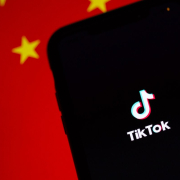 tiktok-running-on-an-iphone-chinas-flag-is-displayed-behind-it-stockpack-unsplash.jpg TikTok running on an iPhone. China's flag is displayed behind it.