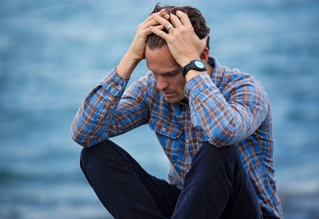 man-in-blue-and-brown-plaid-dress-shirt-touching-his-hair-stockpack-pexels.jpg Man in blue and brown plaid dress shirt touching his hair