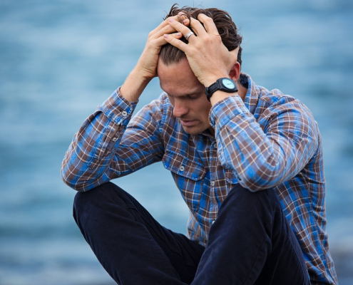 man-in-blue-and-brown-plaid-dress-shirt-touching-his-hair-stockpack-pexels.jpg Man in blue and brown plaid dress shirt touching his hair