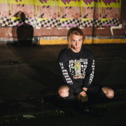 man-sitting-on-concrete-pavement-stockpack-unsplash.jpg man sitting on concrete pavement