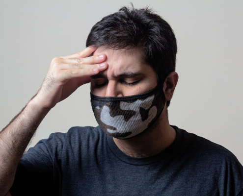 A sick man having headache feeling unwell