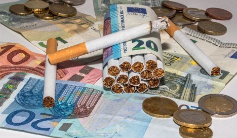 cigarettes, bank note, rolled cigarettes