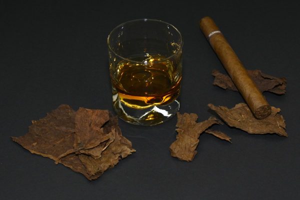 cigar, tobacco leaves, whiskey glass