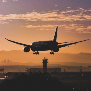 white-passenger-plane-flying-over-the-city-during-sunset-stockpack-pexels.jpg White passenger plane flying over the city during sunset