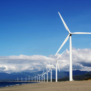 white-wind-turbines-on-gray-sand-near-body-of-water-stockpack-pexels.jpg White wind turbines on gray sand near body of water