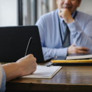 woman-filling-job-application-form-in-office-with-boss-stockpack-pexels.jpg Woman filling job application form in office with boss