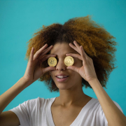 Woman holding two coins