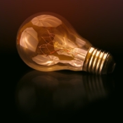 incandescent bulb on black surface