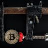 Black and red caliper on gold colored bitcoin