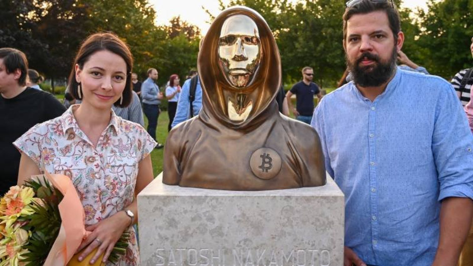 Hungarian Sculptors And Creators Reka Gergely L And Tamas Gilly R Pose Next To The Statue Of Satoshi 1631815966 8108