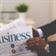 person-holding-white-and-blue-business-paper-stockpack-pexels.jpg Person holding white and blue business paper