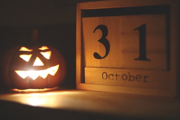 Halloween themed jack o lantern lamp near october 31 calendar