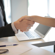 Person in black suit hired an employee