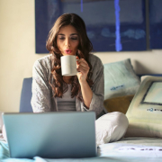 woman-in-grey-jacket-sits-on-bed-uses-grey-laptop-stockpack-pexels.jpg Woman in grey jacket sits on bed uses grey laptop