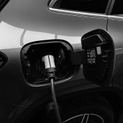 Monochrome photo of hybrid car charging