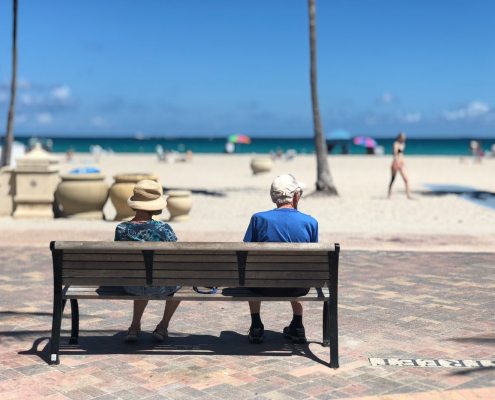 man-and-woman-sitting-on-brown-wooden-bench-stockpack-pexels.jpg Man and woman sitting on brown wooden bench