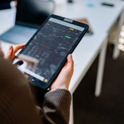 a-person-holding-tablet-with-graph-on-screen-stockpack-pexels.jpg A person holding tablet with graph on screen