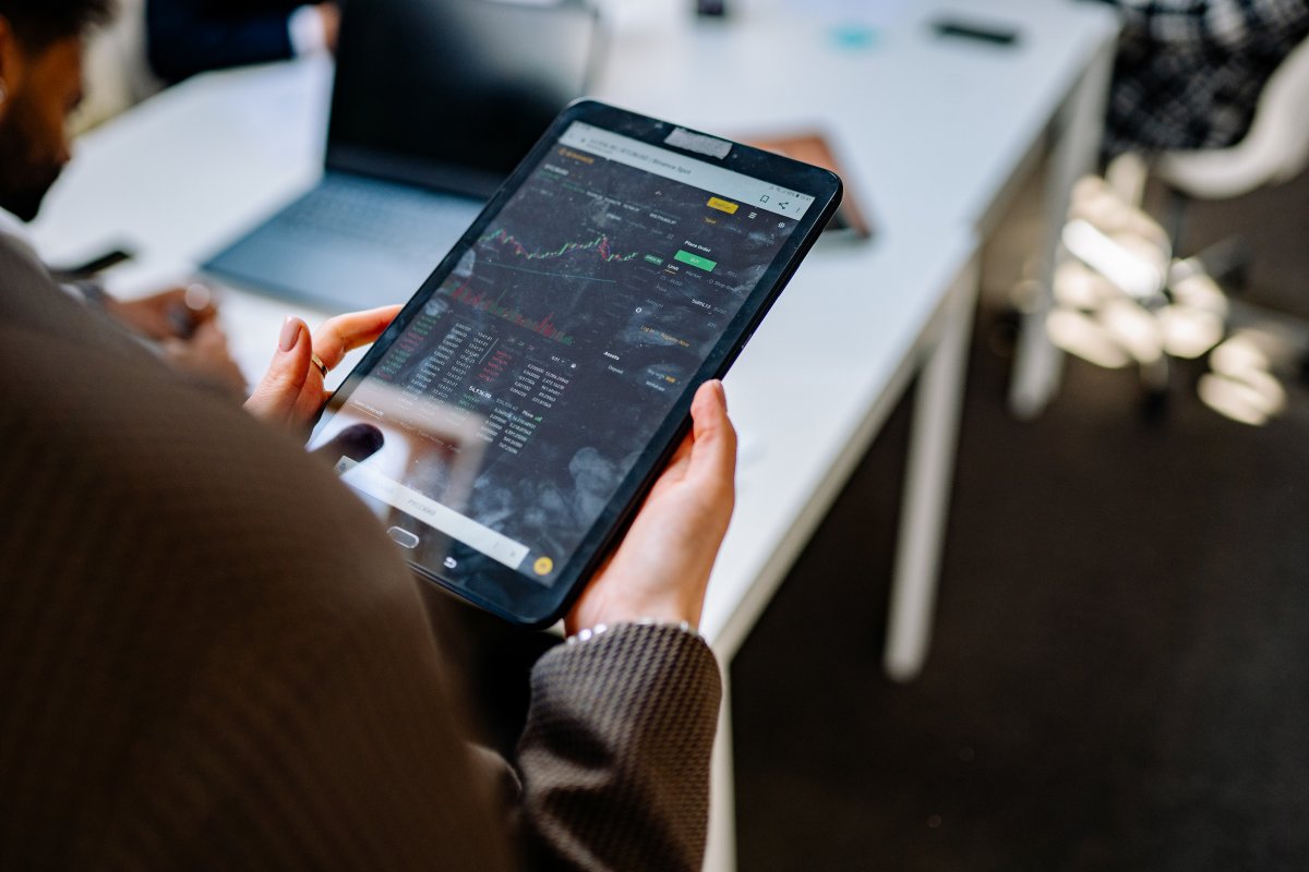 a-person-holding-tablet-with-graph-on-screen-stockpack-pexels.jpg A person holding tablet with graph on screen