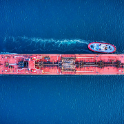 A red oil tanker shot from directly above.