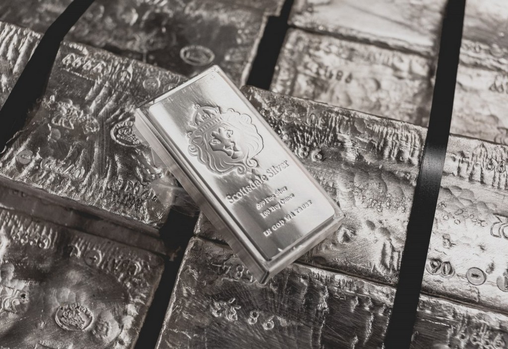 a-scottsdale-mint-stacker-bar-sits-on-top-of-a-pallet-of-raw-silver-stockpack-unsplash.jpg A Scottsdale Mint stacker bar sits on top of a pallet of raw silver.