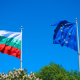Bulgarian and EU flags waving on blue sky