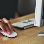 Person holding apple magic mouse