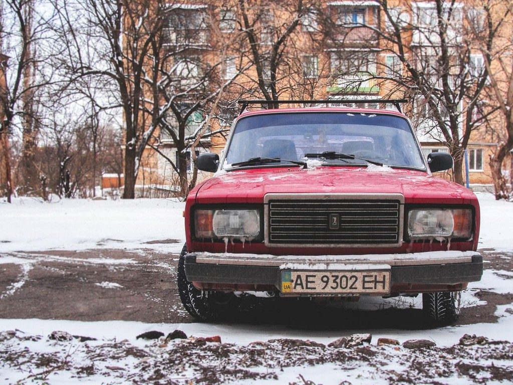 red-car-in-a-snowy-lot-stockpack-unsplash.jpg Red car in a snowy lot
