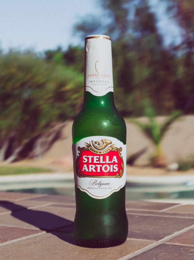 selective-focus-photography-of-stella-artois-bottle-on-beside-pool-stockpack-unsplash.jpg selective focus photography of Stella Artois bottle on beside pool