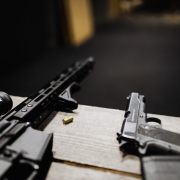 a-rifle-and-a-handgun-on-a-desk-stockpack-pexels.jpg A rifle and a handgun on a desk