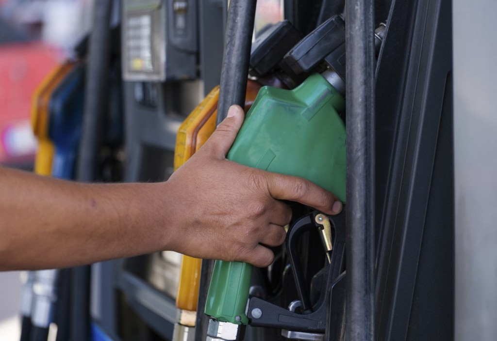 Petrol pump filling nozzles gas station in a service