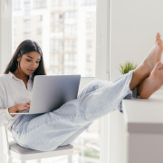 a-woman-using-a-laptop-while-sitting-on-the-chair-with-her-feet-up-on-the-counter-top-stockpack-pexels.jpg A woman using a laptop while sitting on the chair with her feet up on the counter top