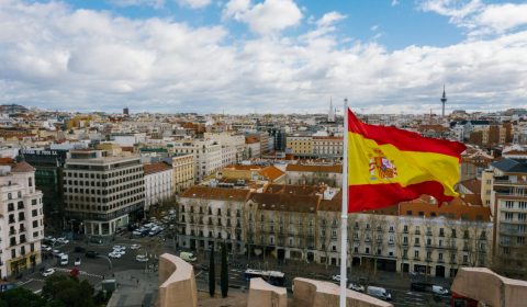 Spanish national flag against cityscape