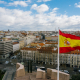 Spanish national flag against cityscape
