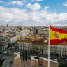 Spanish national flag against cityscape