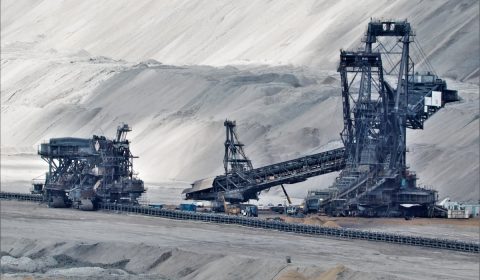 A bucket wheel excavator in a coal mine in grayscale photography