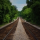 brown-train-railway-between-green-trees-at-daytime-stockpack-pexels.jpg Brown train railway between green trees at daytime