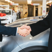 close-up-of-men-shaking-hands-and-cars-in-background-stockpack-pexels.jpg Close up of men shaking hands and cars in background
