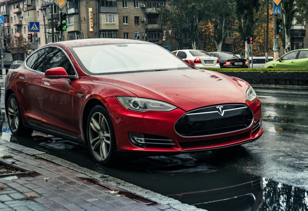 red-tesla-car-on-the-roadside-stockpack-pexels.jpg Red tesla car on the roadside