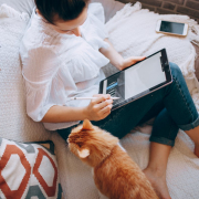 young-female-graphic-designer-using-tablet-on-couch-with-cute-cat-stockpack-pexels.jpg Young female graphic designer using tablet on couch with cute cat