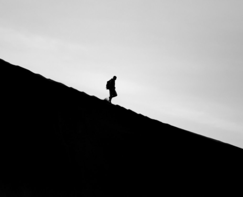 silhouette-photo-of-person-walking-on-mountain-stockpack-unsplash.jpg silhouette photo of person walking on mountain