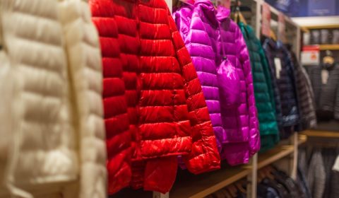 Assorted color bubble jackets hanged