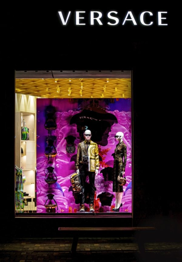 Displayed mannequins with clothes on the window