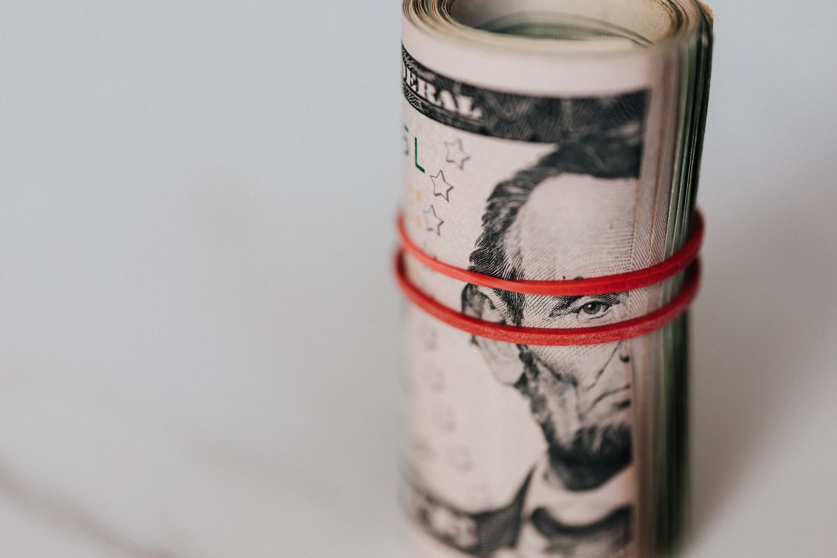 roll-of-american-dollars-tightened-with-red-band-stockpack-pexels.jpg Roll of american dollars tightened with red band