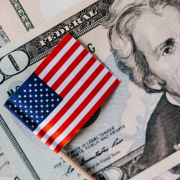 set-of-usa-dollars-and-national-flag-stockpack-pexels.jpg Set of usa dollars and national flag
