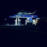 Helicopter on top of a gasoline station