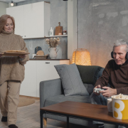 Woman serving food to a gamer