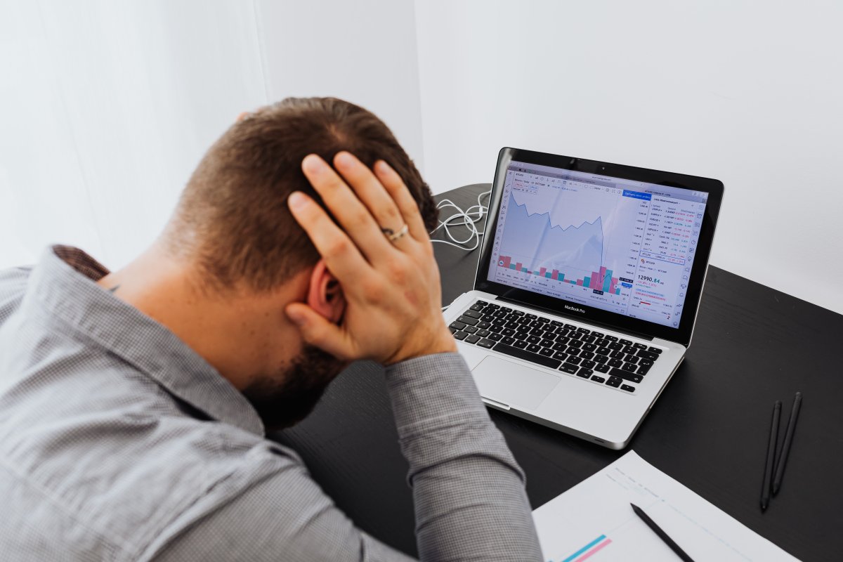 man-with-laptop-on-desk-terrified-by-stock-market-chart-stockpack-pexels.jpg Man with laptop on desk terrified by stock market chart