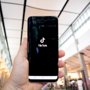 hand-of-man-holding-mobile-phone-opening-tik-tok-application-in-shopping-mall-stockpack-unsplash.jpg Hand of man holding mobile phone opening Tik Tok application, in shopping mall.