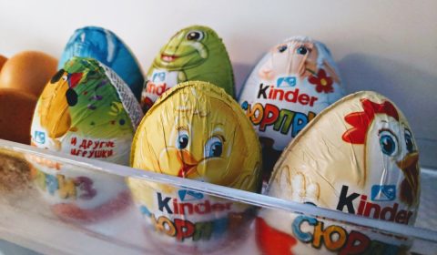 a bunch of kinder eggs in a refrigerator